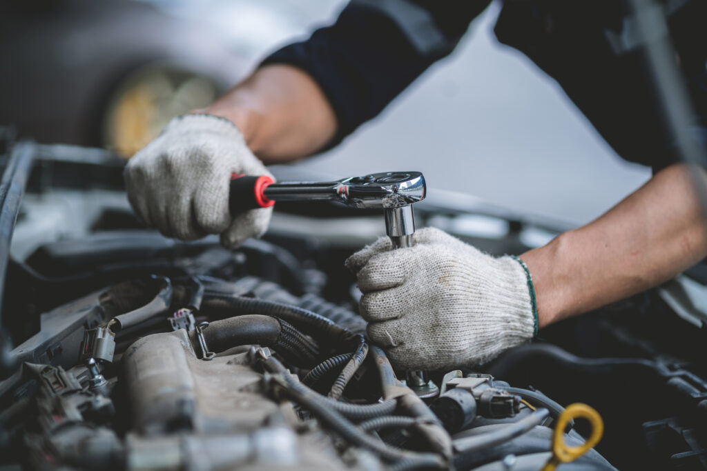 a-man-is-working-on-a-diesel-car-engine